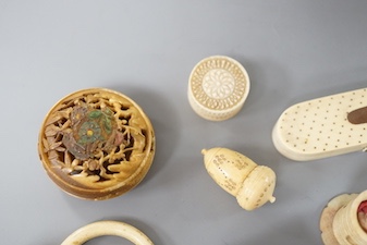 A collection of ivory objects, to include a manju netsuke, a needle box, miniature dominos, etc., 19th century